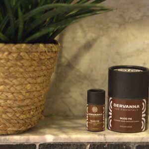 Skincare products beside a woven basket plant.